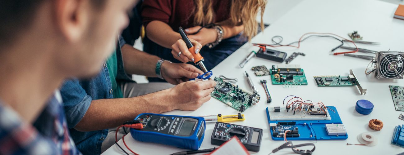 GTC students working on an electric vehicle