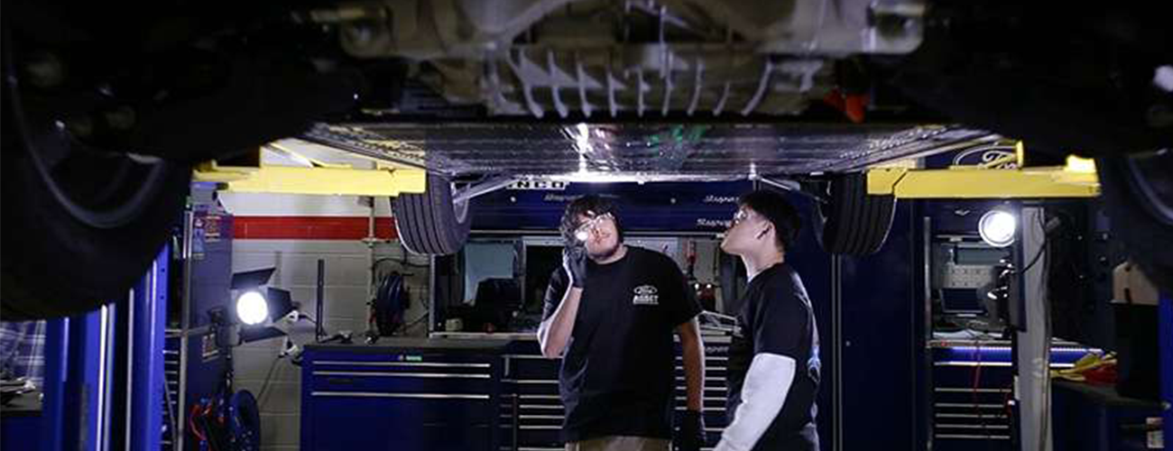 GTC students working on an electric vehicle